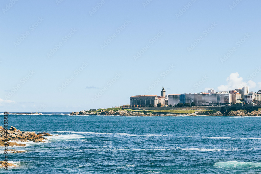 View of waves of ocean laying on the near city waters of A Coruña city