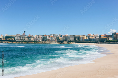 View of huge white waves of ocean laying on the main beach of A Coruña city © Radu