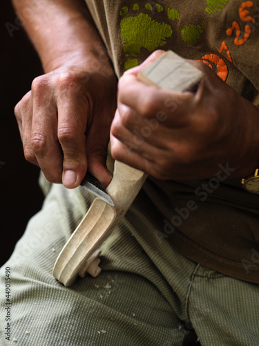 Luthier violinmaker scultping a classic violin curl photo