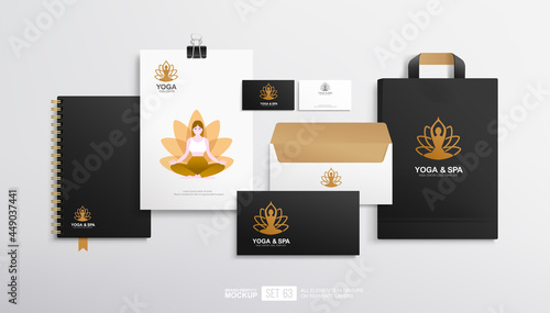 Business stationery branding mockup set with concept of lotos pose yoga and spa logo design. Brand identity set of blank, shopping bag, yoga flyer, business card and envelope. Black stationery