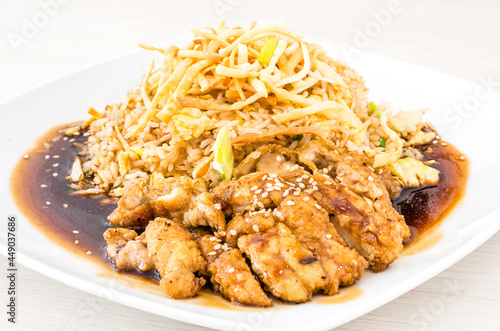 Chinese and Peruvian fusion food: salty chicken with chaufa rice called chijaukay