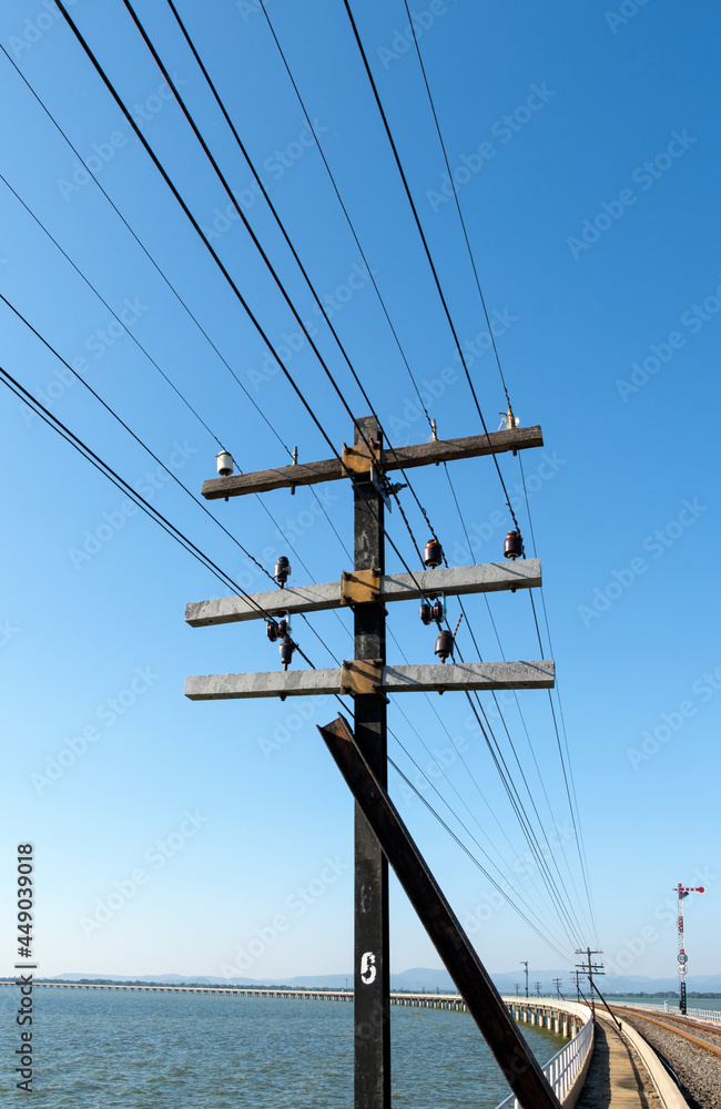 The metal pole of the telegraph network system on the concrete bridge. The metal pole of the telegraph network system on the concrete bridge.