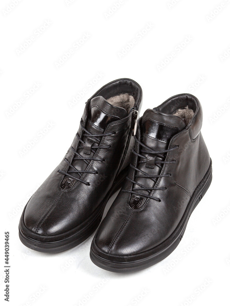Classsic new men's black winter leather fur boots isolated on white background Classsic new men's black winter leather fur boots isolated on white background