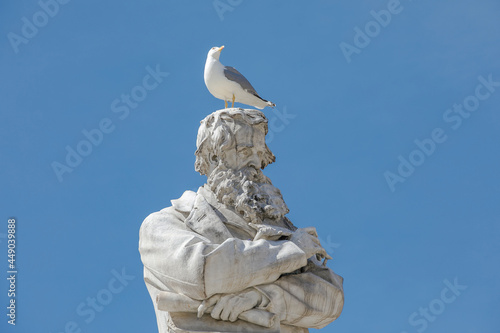 Details of stone statue of Niccolò Tommaseo in Venice, Italy © Elisabetta