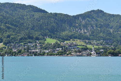 A large body of water with a mountain in the background © Jakub