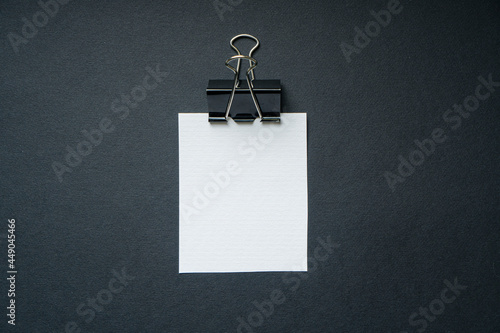 Empty white paper page for mockup with a binder clip