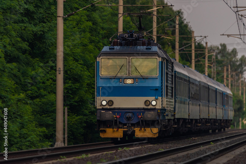 Trains and whistle stop Olesko in central Bohemia in sunset orange evening