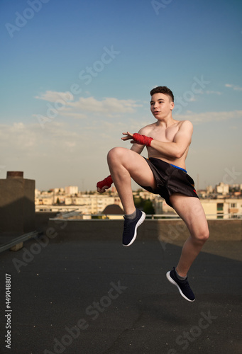 Kickbox fighter training in urban environment