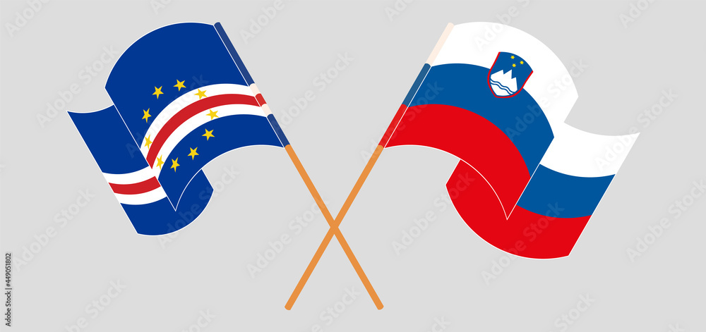 Crossed and waving flags of Cape Verde and Slovenia