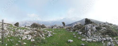 Lasithi Plateau mountain landscapes with cloudy sky on Crete Island in Greece. photo