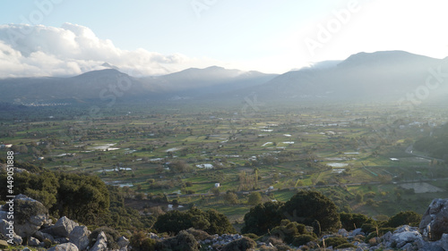 Lasithi Plateau mountain landscapes with cloudy sky on Crete Island in Greece. photo