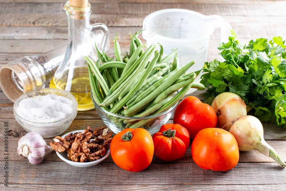 Ingredients for cooking lobio of green beans with vegetables and tomato. Step by step recipe. Ingredients for cooking lobio of green beans with vegetables and tomato. Step by step recipe.