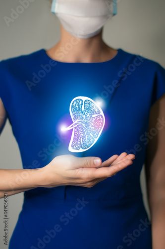 Woman in blue clothes holding virtual sketchy drawing of spleen in hand. Handrawn human organ, detox and healthcare, healthcare hospital service concept stock photo