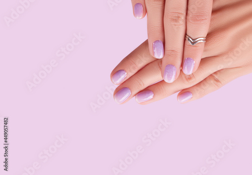 Womans hands with trendy lavender manicure. Spring summer nail design