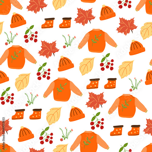 Seamless autumn pattern with a sweater and a cap and rubber boots.