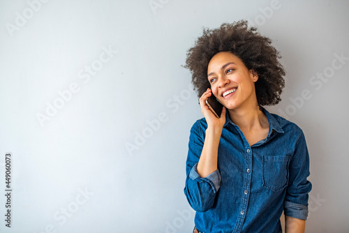 Bilde på lerret Young happy woman talking on the cellphone