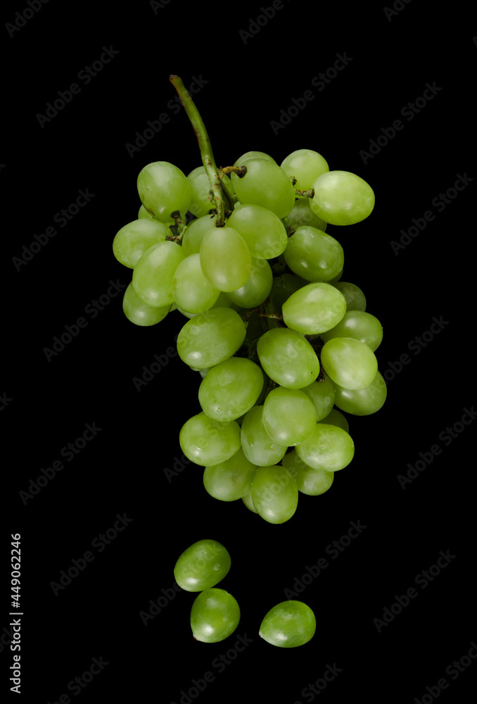 White pouring grapes, with large cubes on a black background isolated White pouring grapes, with large cubes on a black background isolated