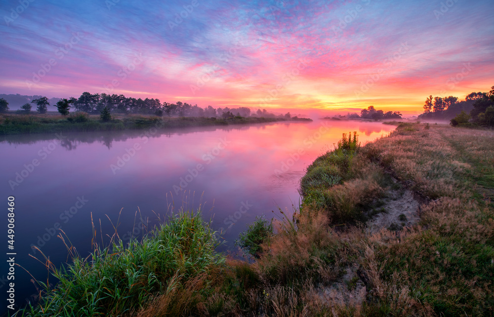 Fototapeta premium Colorful sunrise over the river banks