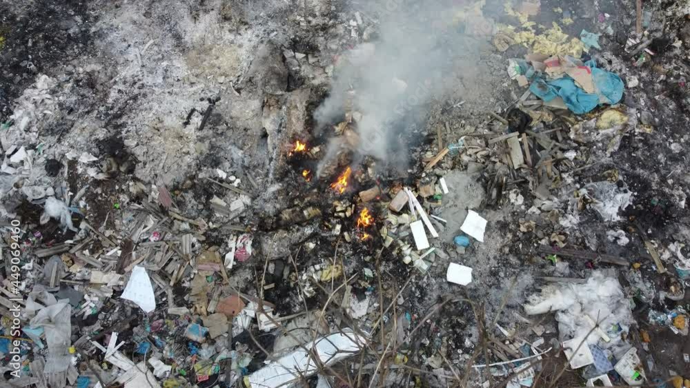 Aerial view open burning rubbish cause smoke release created air pollution. Environment pollution, global warning. Aerial view open burning rubbish cause smoke release created air pollution. Environment pollution, global warning.