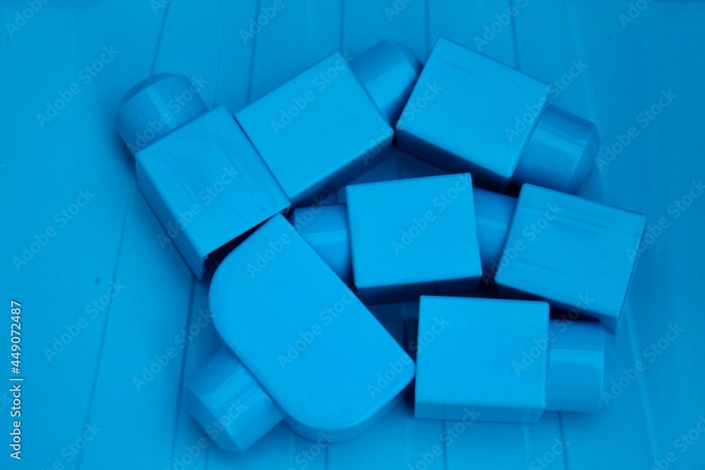 Large blue constructor elements on a blue plastic background Large blue constructor elements on a blue plastic background