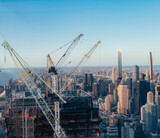 construction site with cranes New York City buildings real state usa 