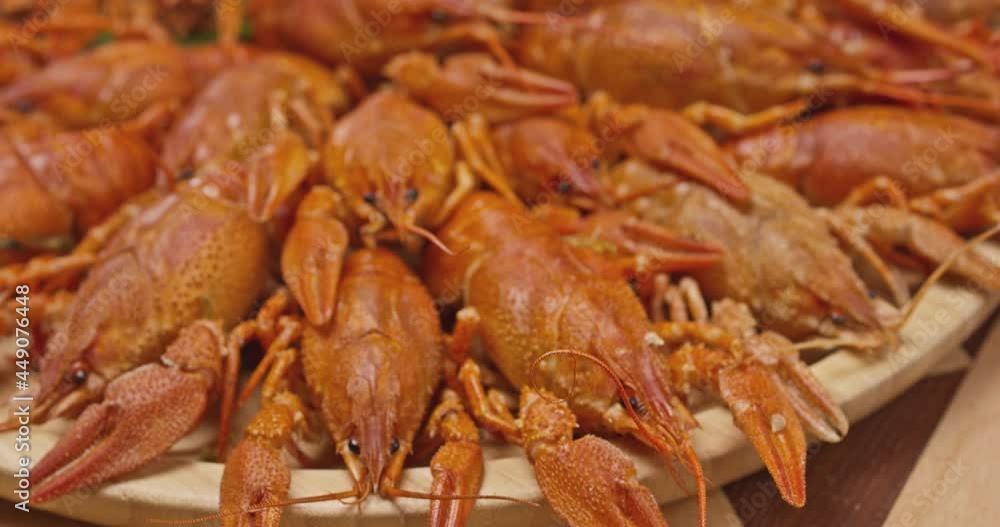 River boiled crayfish a good snack to beer. Waiter puts on the table a plate of boiled red river cancer . A plate of fuming or smoking hot crawfish in the restaurant. Shot on RED Camera Slow motion. River boiled crayfish a good snack to beer. Waiter puts on the table a plate of boiled red river cancer . A plate of fuming or smoking hot crawfish in the restaurant. Shot on RED Camera Slow motion.