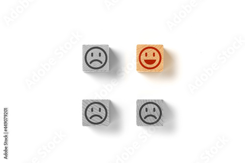 Emoticon faces concept. Black and white sad. In color is happy. The one, election the best. Flat lay photo © AlexPhotoStock