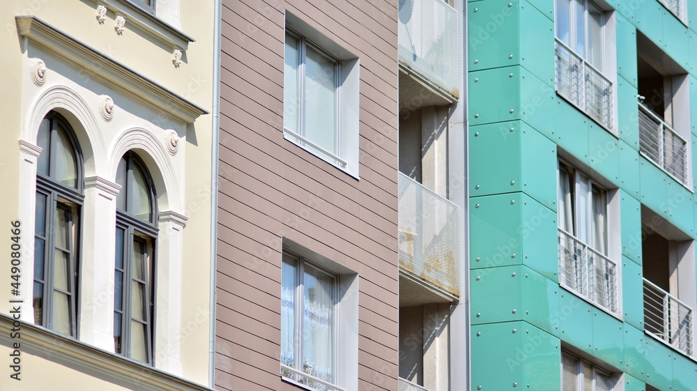 Detailed view of modern townhouses in row of. Original townhouses in a residential area. Buildings predominantly made of glass, steel and concrete. Detailed view of modern townhouses in row of. Original townhouses in a residential area. Buildings predominantly made of glass, steel and concrete.