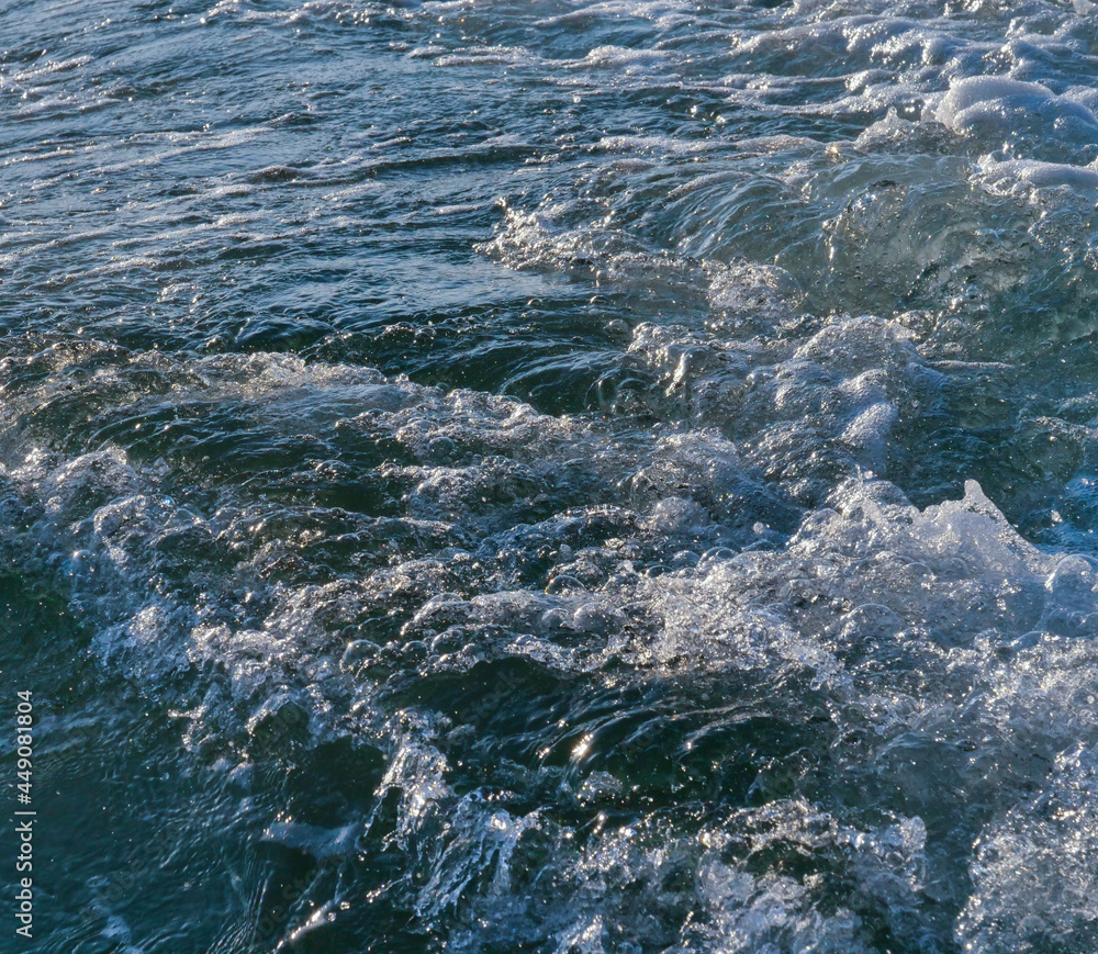 Fototapeta premium Big splashing waves produced by a boat engine