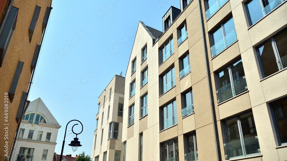 Detailed view of modern townhouses in row of. Original townhouses in a residential area. Buildings predominantly made of glass, steel and concrete. Detailed view of modern townhouses in row of. Original townhouses in a residential area. Buildings predominantly made of glass, steel and concrete.
