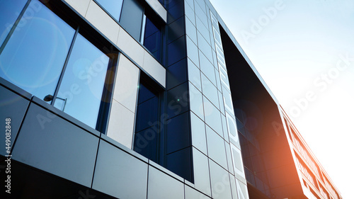 Quadro su tela Futuristic facade of a modern office building clad in glass