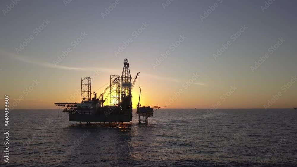 Aerial view of the jack up rig shot during sunset time. Fly around the jack up rig with a drone.
Aerial view of the jack up rig shot during sunset time. Fly around the jack up rig with a drone.