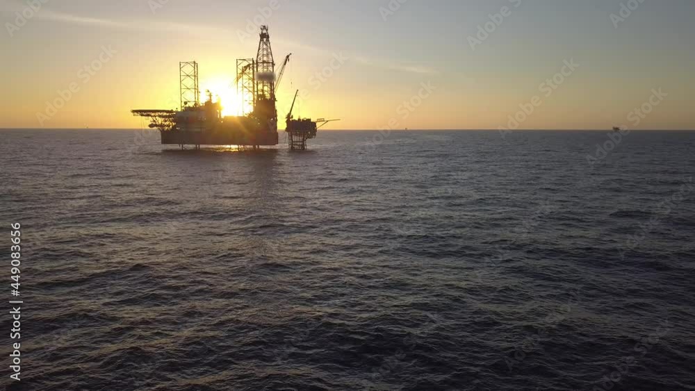 Aerial view of the jack up rig shot during sunset time. Fly around the jack up rig with a drone.
Aerial view of the jack up rig shot during sunset time. Fly around the jack up rig with a drone.