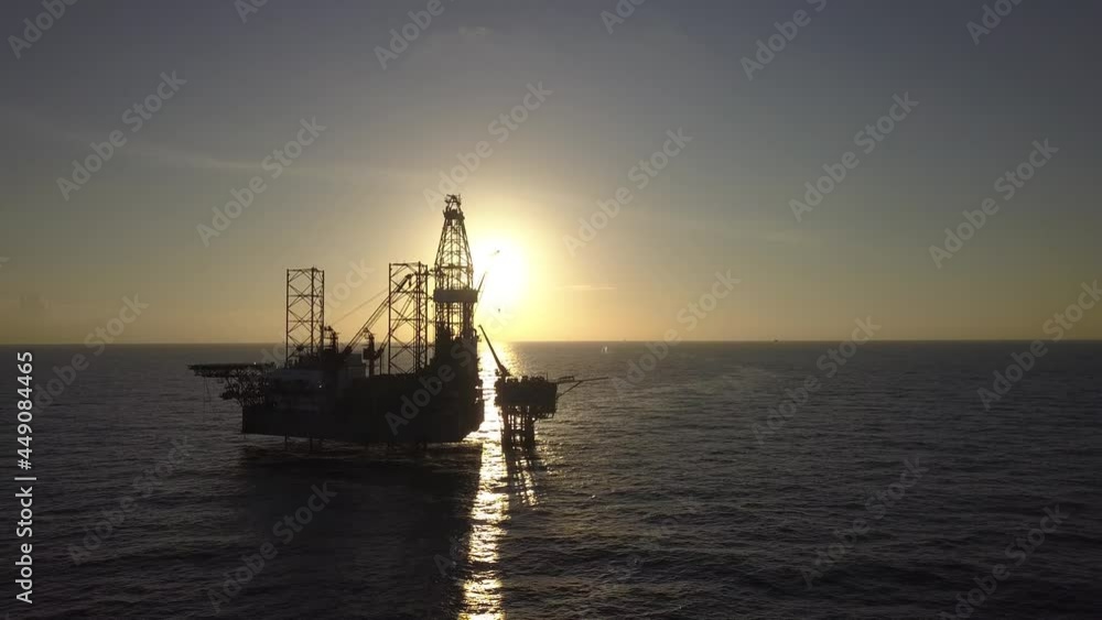 Aerial view of the jack up rig shot during sunset time. Fly around the jack up rig with a drone.
Aerial view of the jack up rig shot during sunset time. Fly around the jack up rig with a drone.
