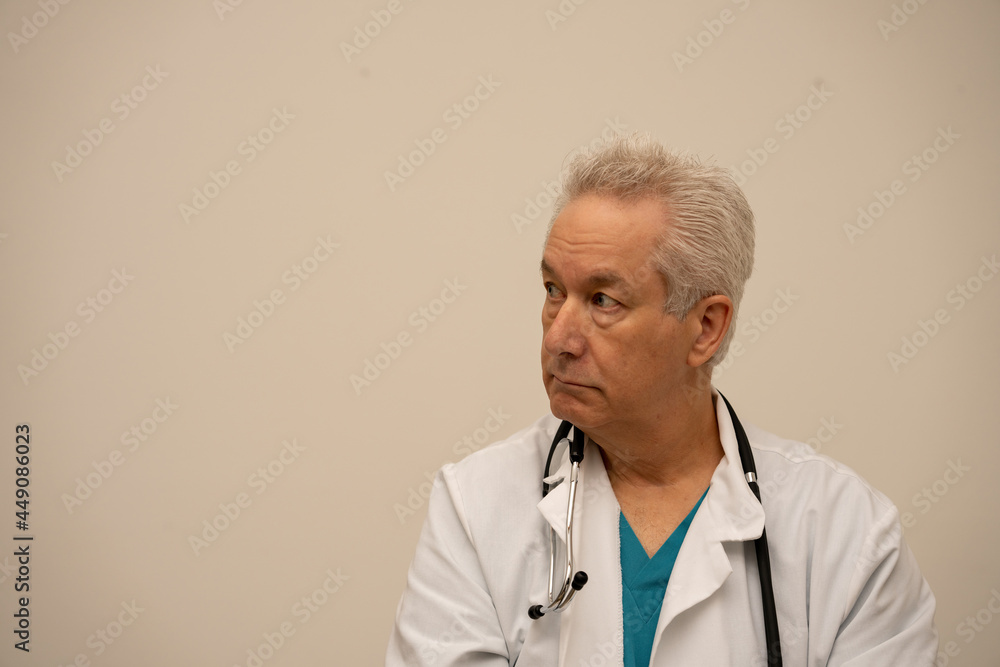 Photo of a doctor looking sideways away from camera Photo of a doctor looking sideways away from camera