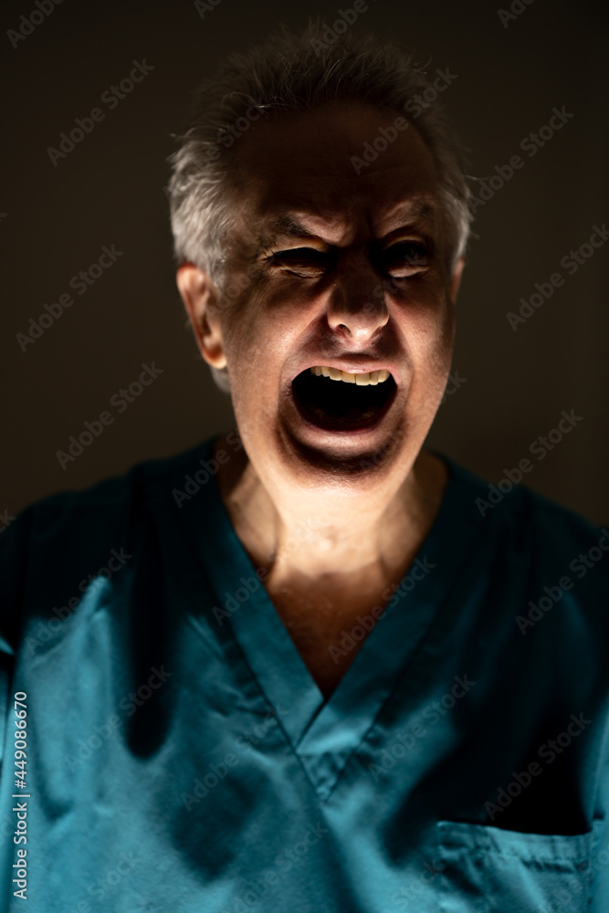Light and shadow contrast photo of a doctor screaming Light and shadow contrast photo of a doctor screaming