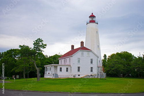 Lighthouse in Sandy Hook, New Jersey, on a cloudy day, during daylight hours with the light turned off -47