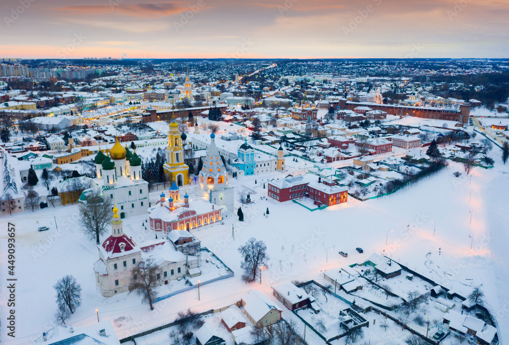 Scenic view from drone of Kolomna cityscape with architectural ensemble of ancient Kremlin on winter evening, Russia