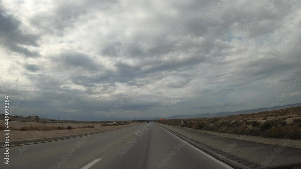 Driving on a highway through southern California's Mojave Desert landscape - driver point of view Driving on a highway through southern California's Mojave Desert landscape - driver point of view