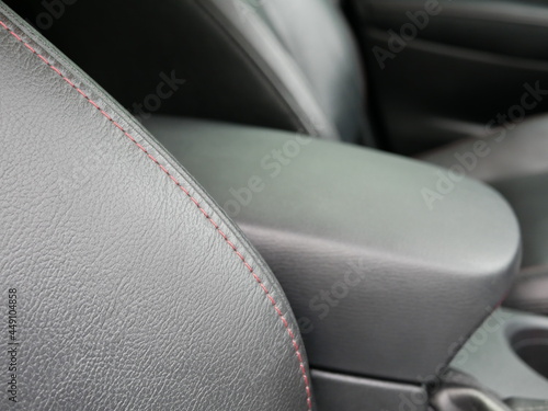 closeup of black leather car seat.  © Chanonnat