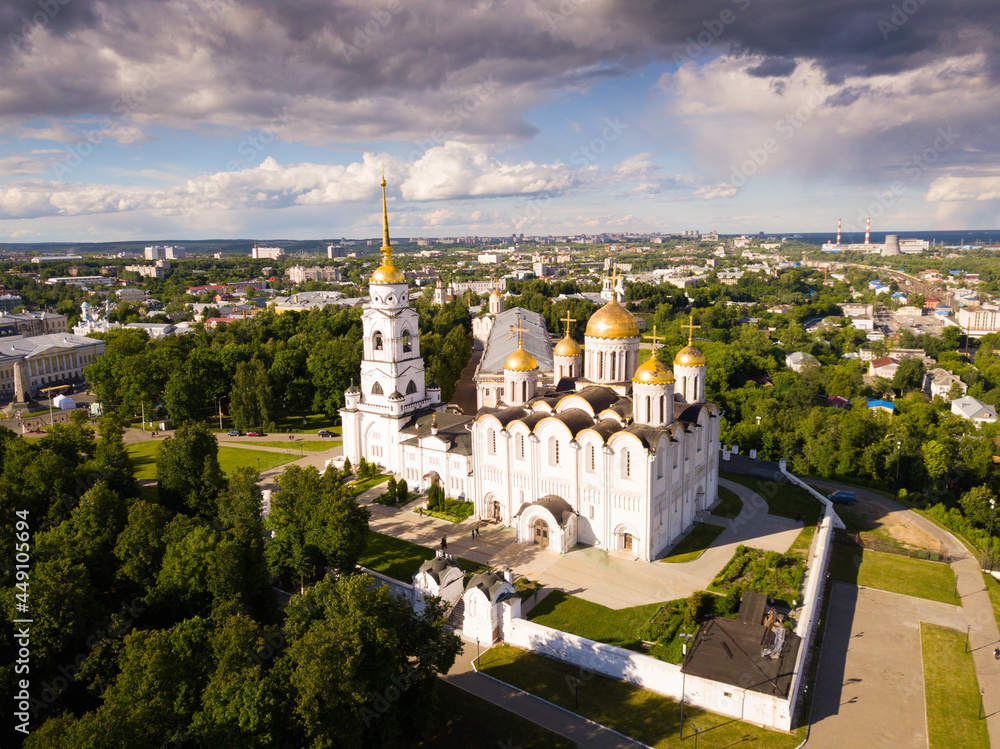 View of Dormition Cathedral on background with Vladimir cityscape in sunny summer day, Russia.