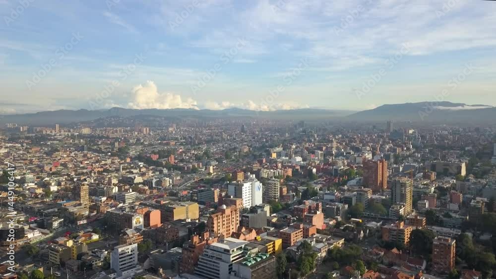 Aerial - Flying over Bogota, views of tops of buildings and mountains in distance, Colombia Aerial - Flying over Bogota, views of tops of buildings and mountains in distance, Colombia