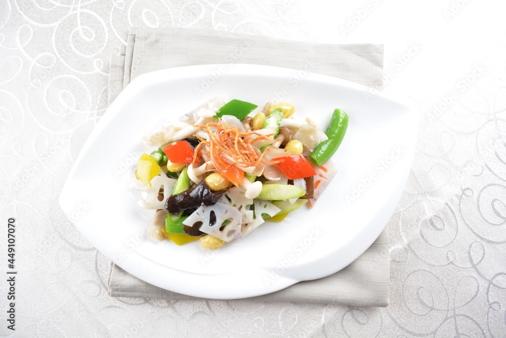 stir fried mixed vegetables with lotus root and seed in soy sauce in white background asian halal menu stir fried mixed vegetables with lotus root and seed in soy sauce in white background asian halal menu