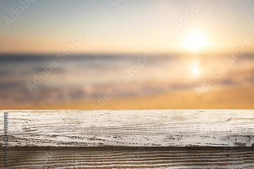 Wood table background, Shelf at cafe shop, Perspective wood over blur cafe with bokeh light background, Table for product display, Empty wooden counter in beach Sunset for mockup, banner, template