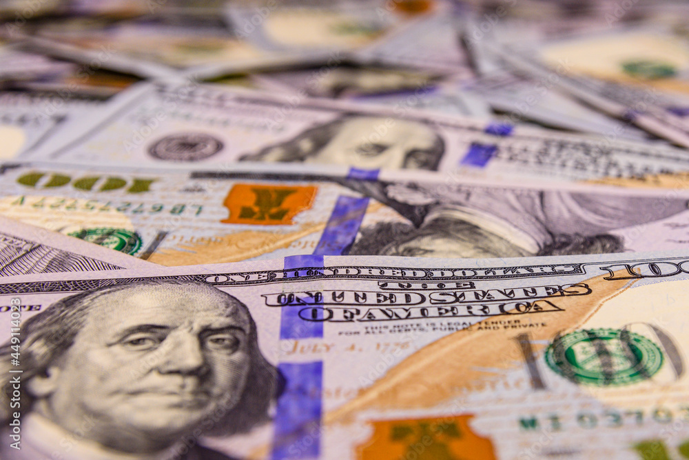 Background of one hundred dollar banknotes. Selective focus Background of one hundred dollar banknotes. Selective focus