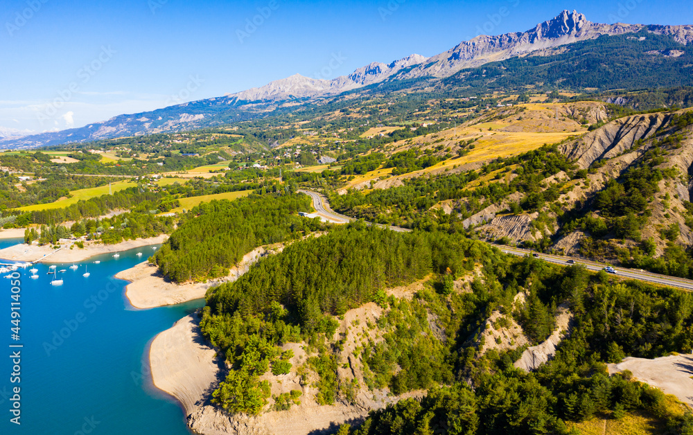 Panoramic scenic view of Serre-Poncon Lake and Alps in southeast France