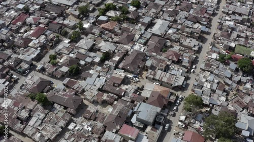 Panning Arial shot looking down at the tin roof huts of Alexandra, a township in Johannesburg,  South Africa. photo