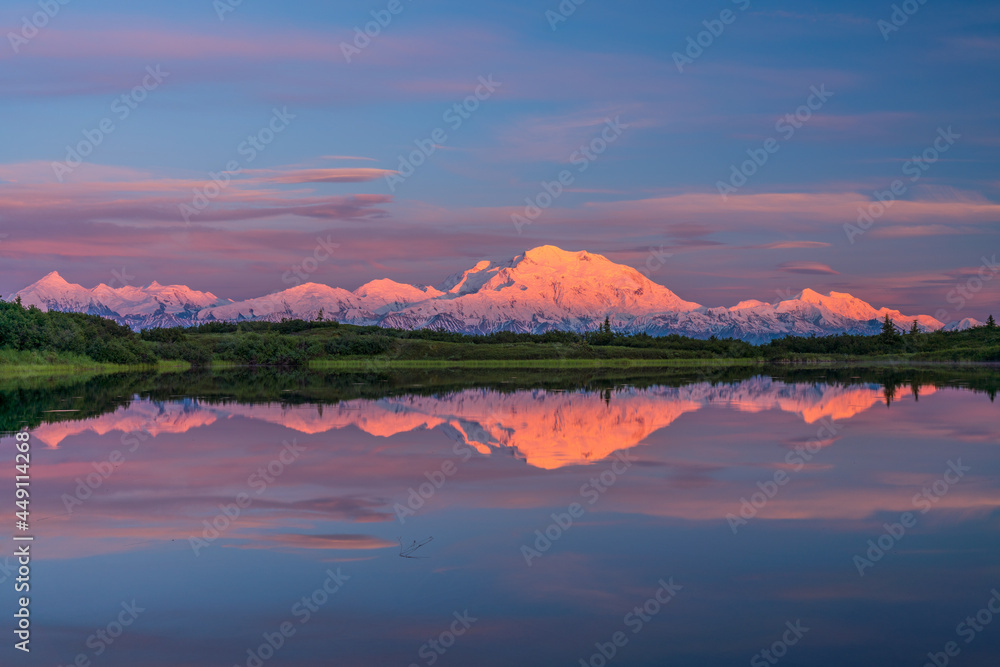 alaska's mount denali reflected in calm Reflecting Pond near Wonder Lake sunset