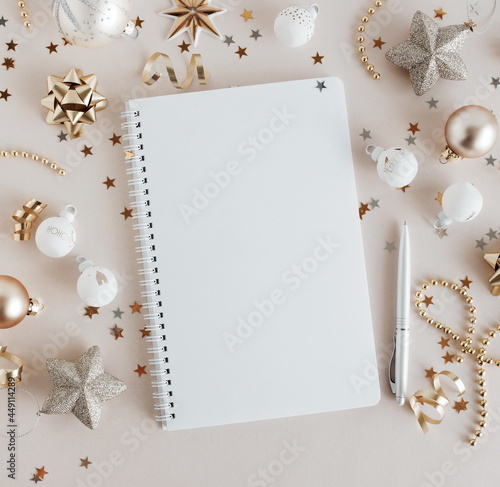 white notebook mockup and Christmas decoration top view with copy space on be...