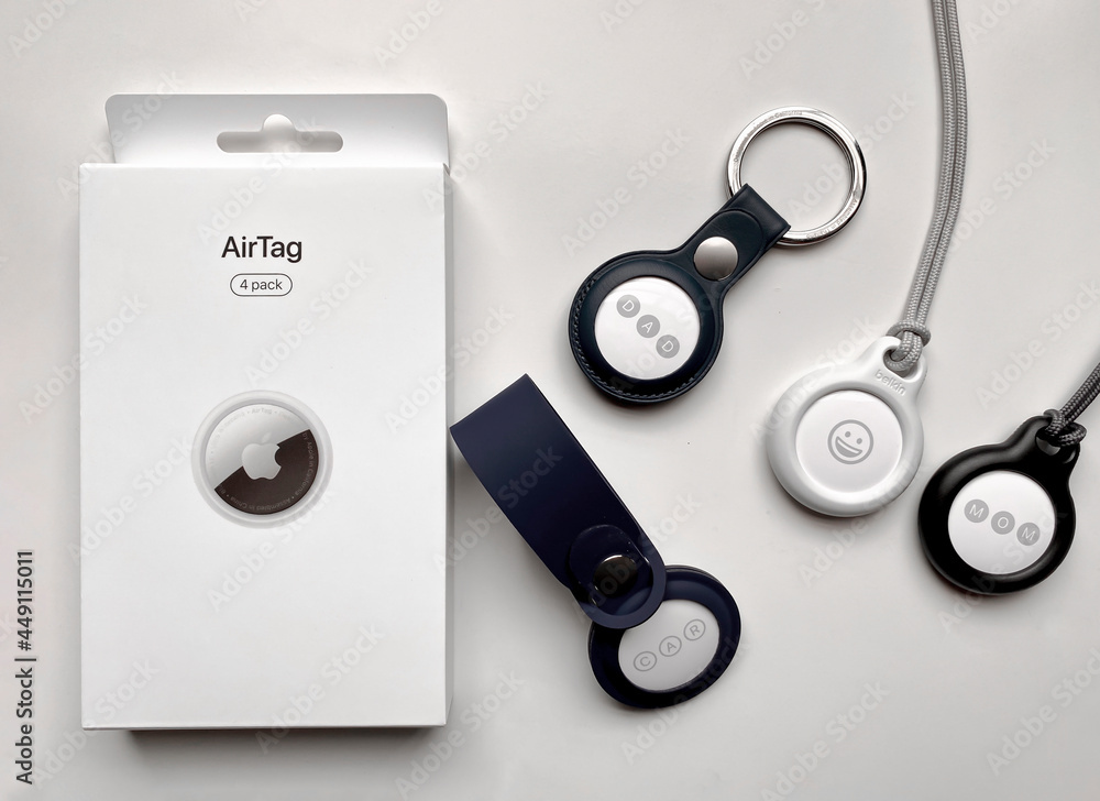 Calgary, Alberta, Canada. Aug 4, 2021. Four AirTags tracking devices  developed by Apple. AirTag is designed to act as a key finder, helping  people find personal objects. Stock Photo | Adobe Stock